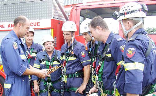 Technical rescue co-ordinator Bruce Shelton demonstrates to Maryborough firefighters Warren McKean, Peter Mapson, Darren Bosel, Paul Sanders and Torquay firefighters Dave Crisp and Justin Williams before heading into the Brolga Theatre for vertical rescue training. Technical rescue co-ordinator Bruce Shelton demonstrates to Maryborough firefighters Warren McKean, Peter Mapson, Darren Bosel, Paul Sanders and Torquay firefighters Dave Crisp and Justin Williams before heading into the Brolga Theatre for vertical rescue training.